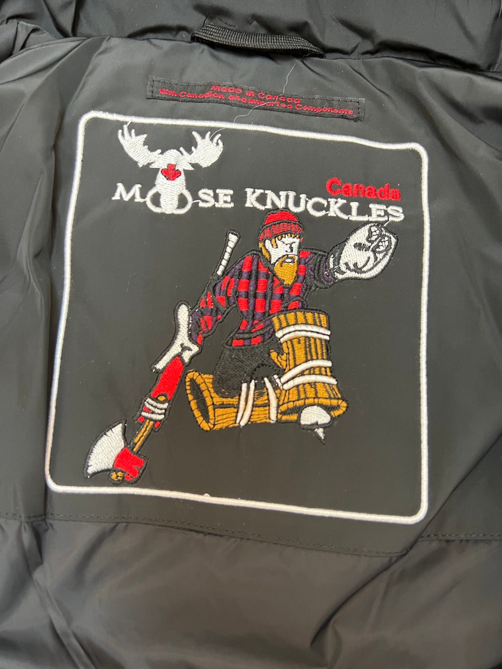 Moose Knuckles Quilted Black Hooded Parka with Gray Trim