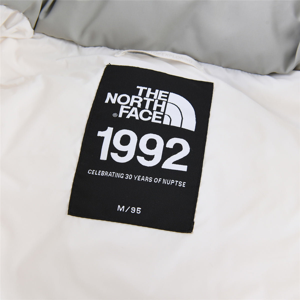 The North Face White and Light Gray Stand-Collar Puffer Jacket