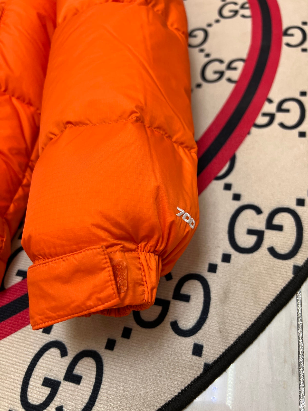 The North Face Quilted Orange and Black Stand-Collar Puffer Jacket