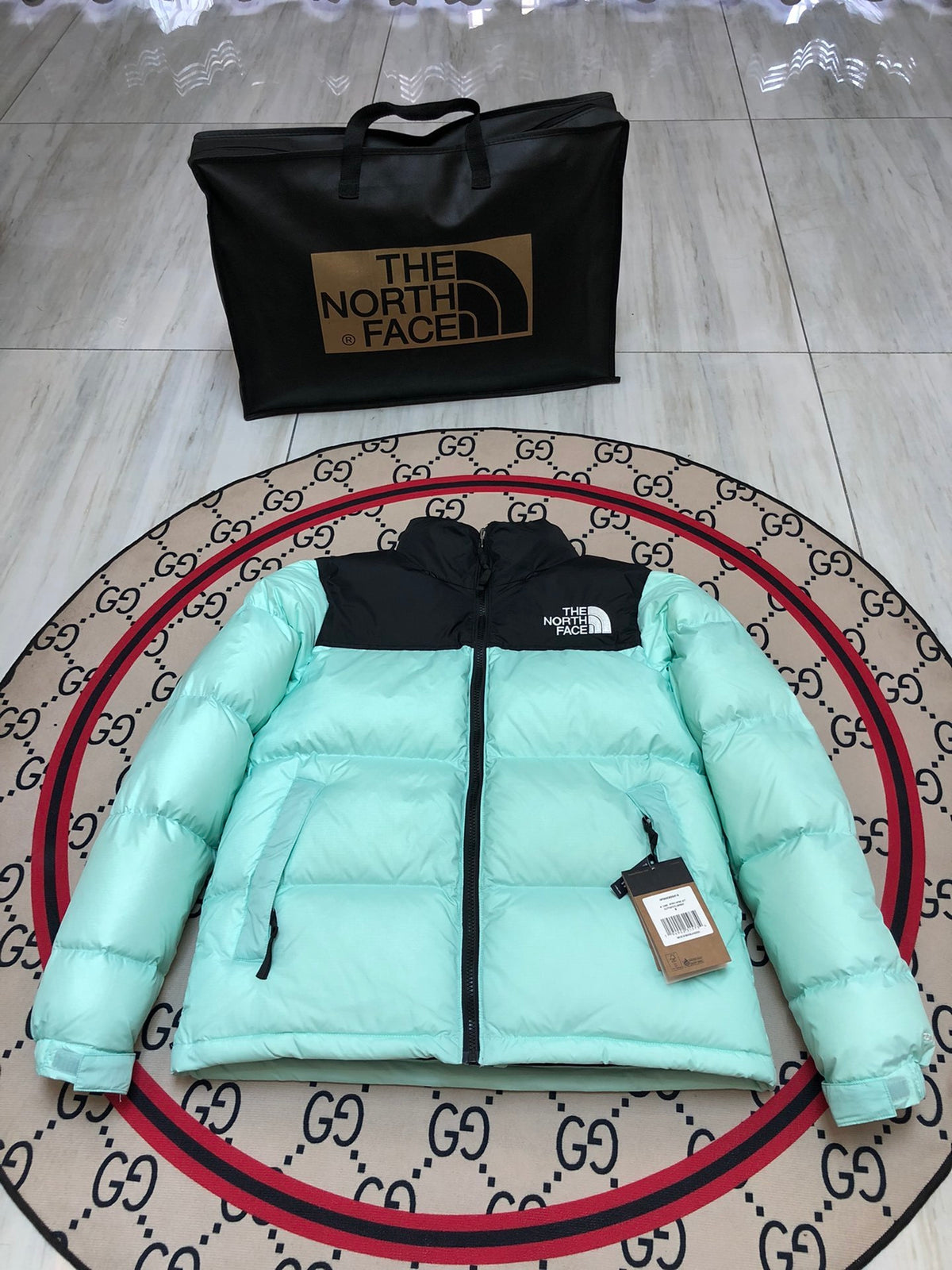 The North Face Quilted Mint Green and Black Stand-Collar Puffer Jacket