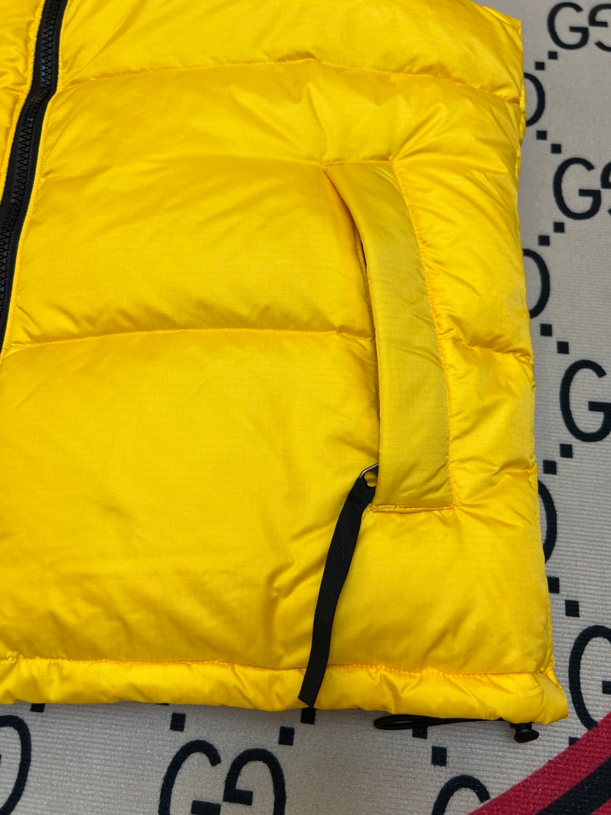 The North Face Quilted Yellow and Black Puffer Vest
