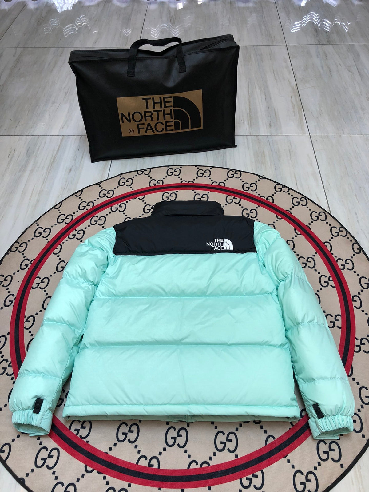 The North Face Quilted Mint Green and Black Stand-Collar Puffer Jacket
