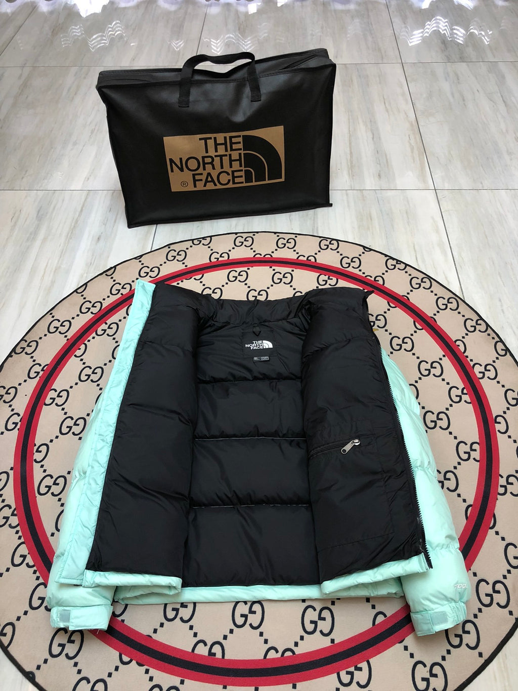The North Face Quilted Mint Green and Black Stand-Collar Puffer Jacket