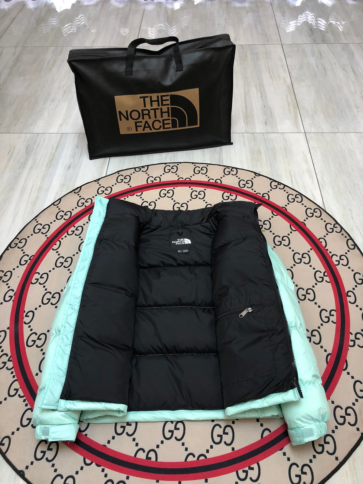 The North Face Quilted Mint Green and Black Stand-Collar Puffer Jacket