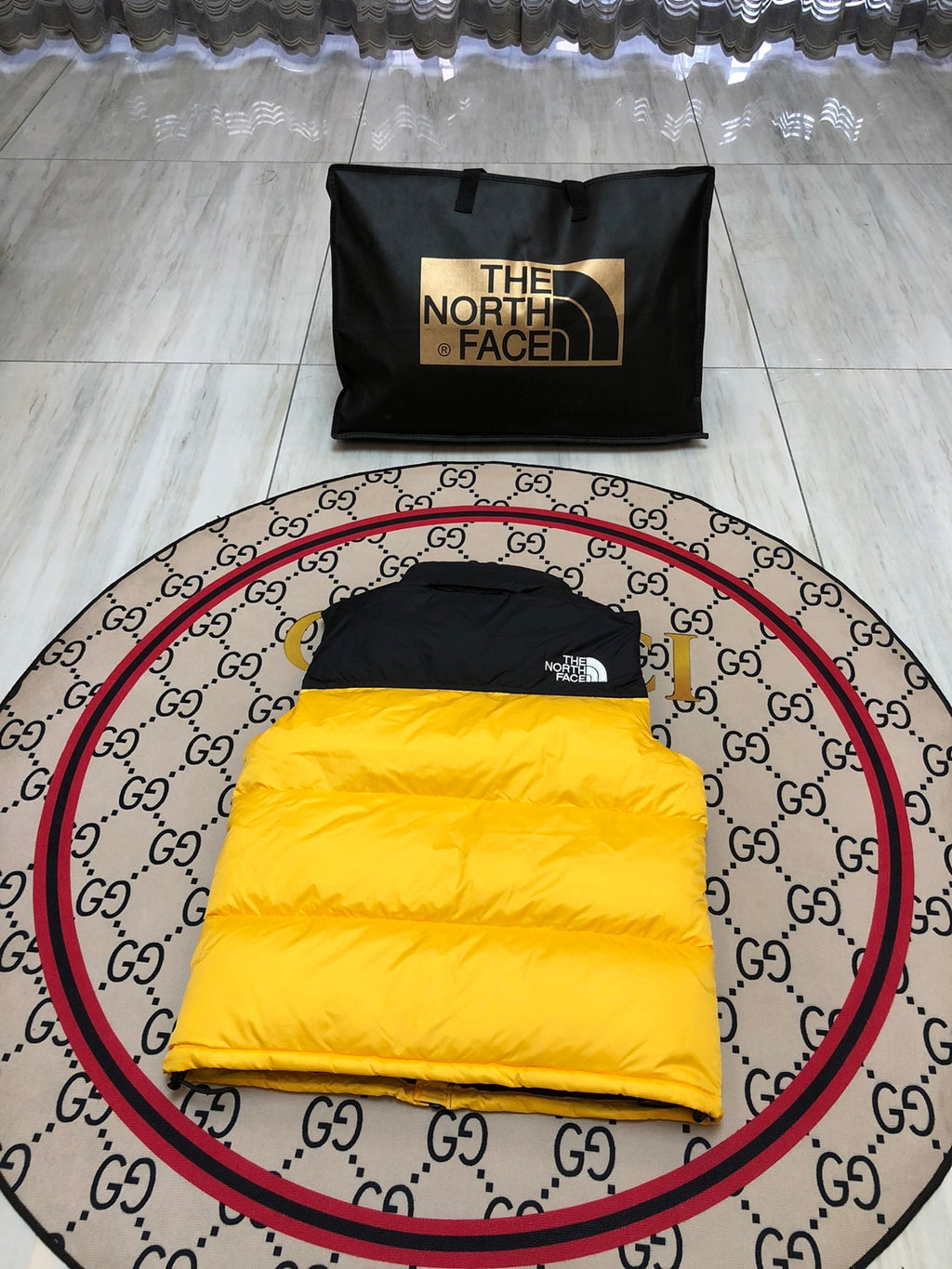 The North Face Quilted Yellow and Black Puffer Vest