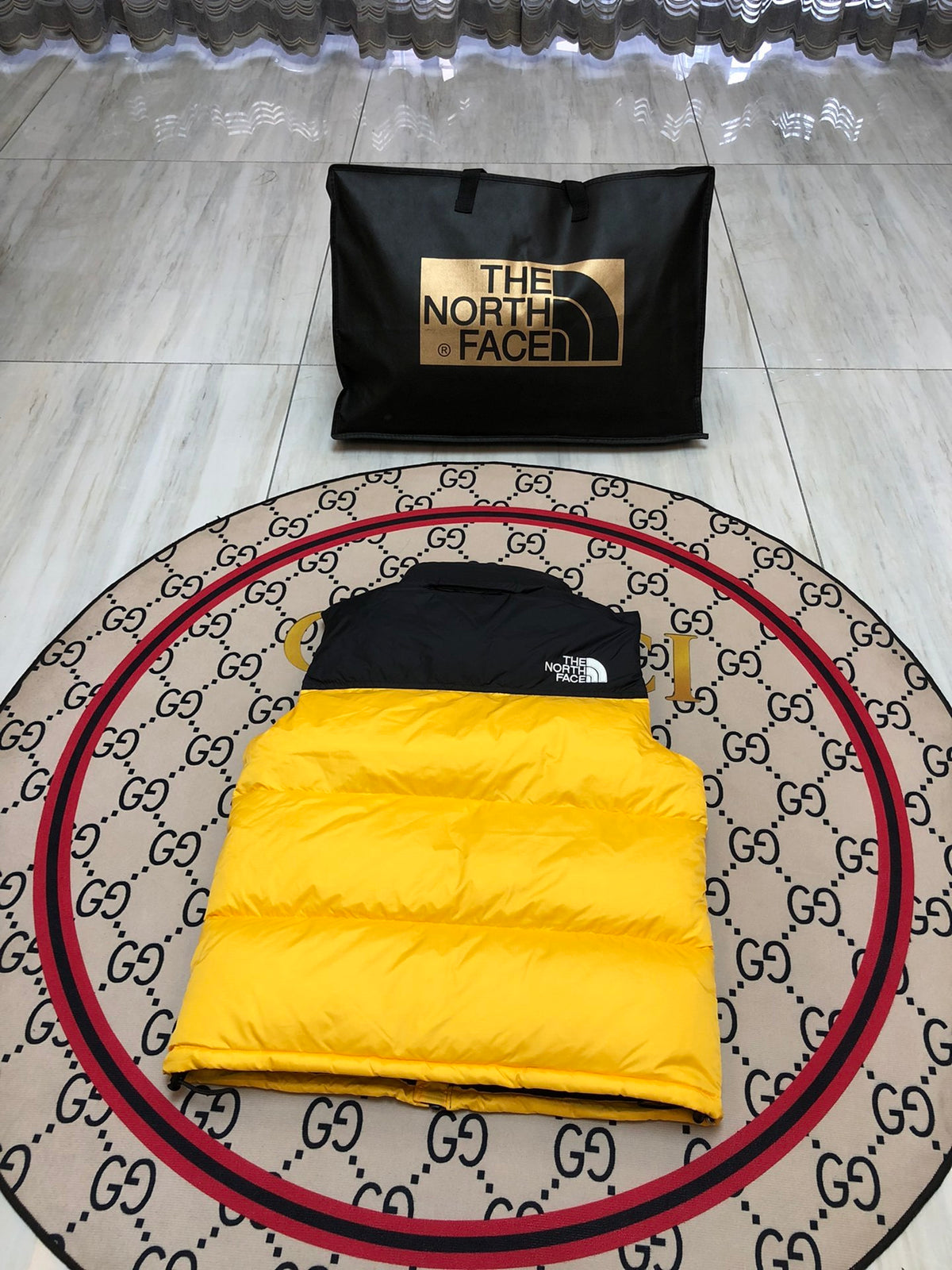 The North Face Quilted Yellow and Black Puffer Vest