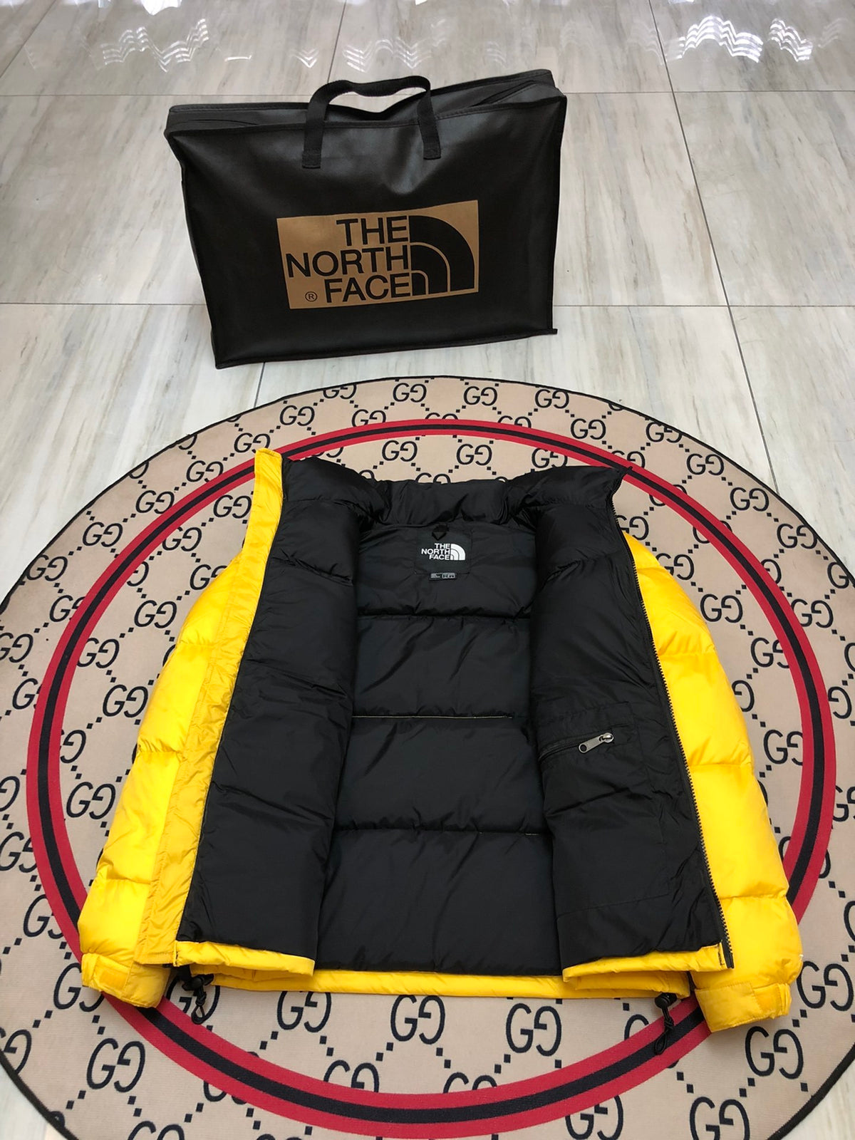 The North Face Quilted Yellow and Black Stand-Collar Puffer Jacket