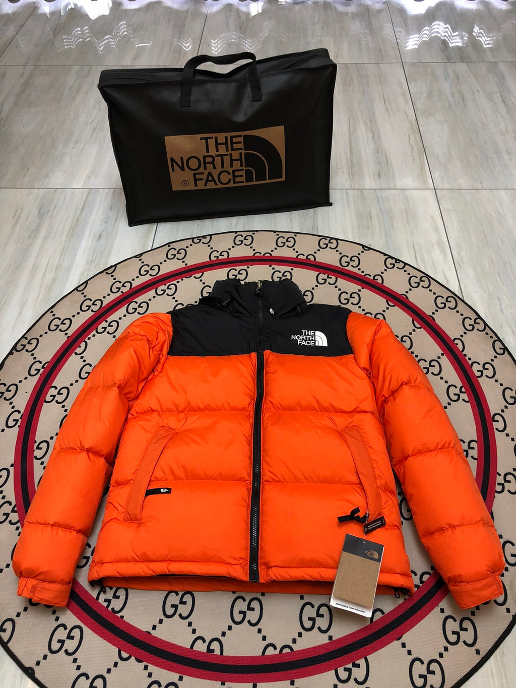 The North Face Quilted Orange and Black Stand-Collar Puffer Jacket