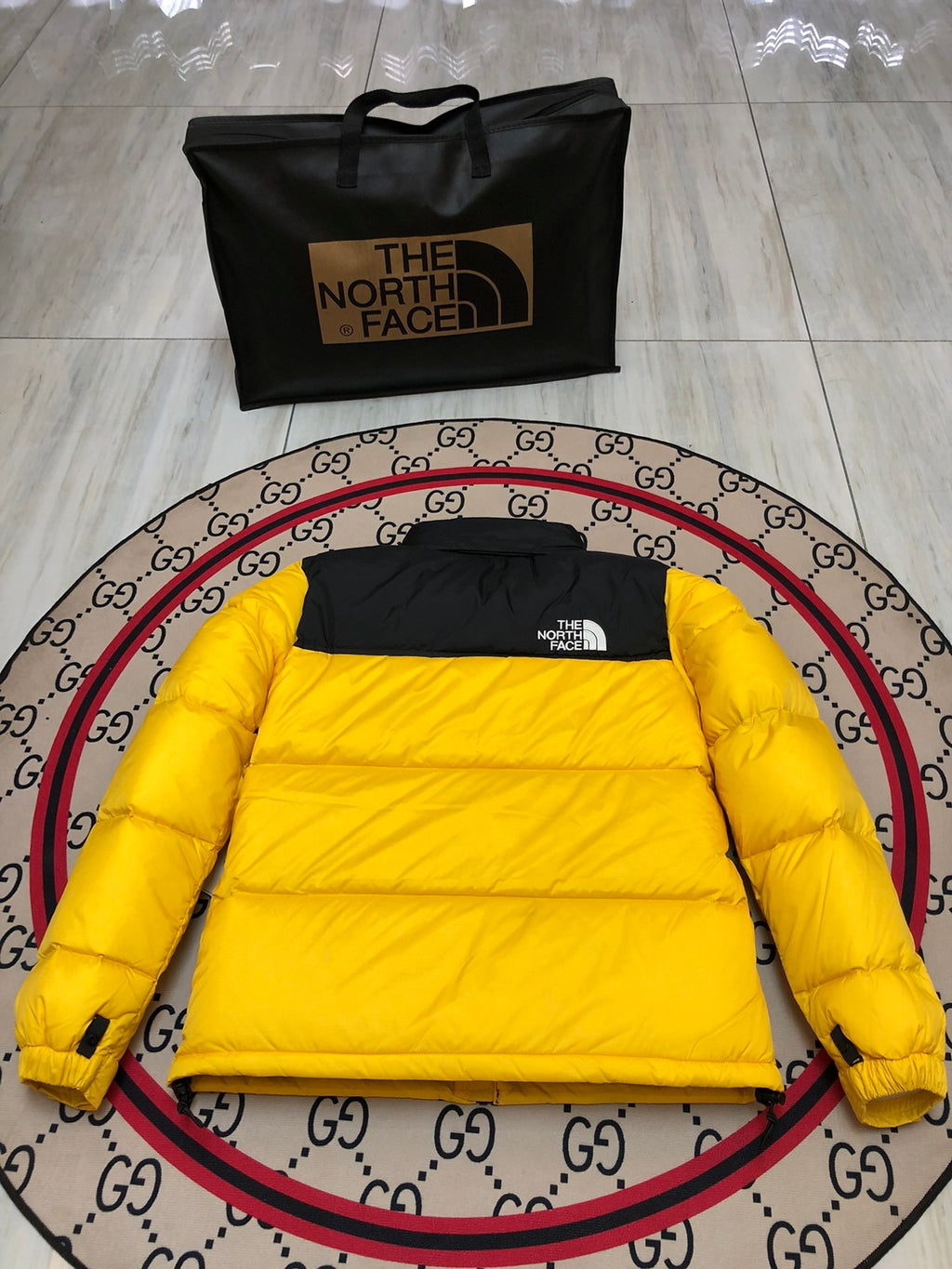 The North Face Quilted Yellow and Black Stand-Collar Puffer Jacket