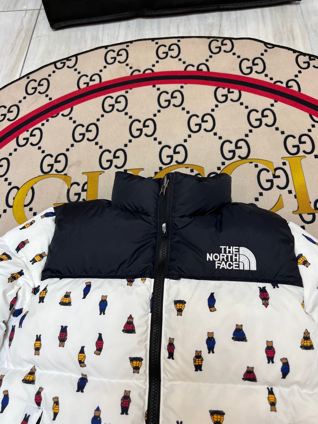 The North Face Quilted White and Black Bear-Print Puffer Jacket