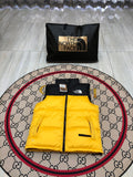 The North Face Quilted Yellow and Black Puffer Vest