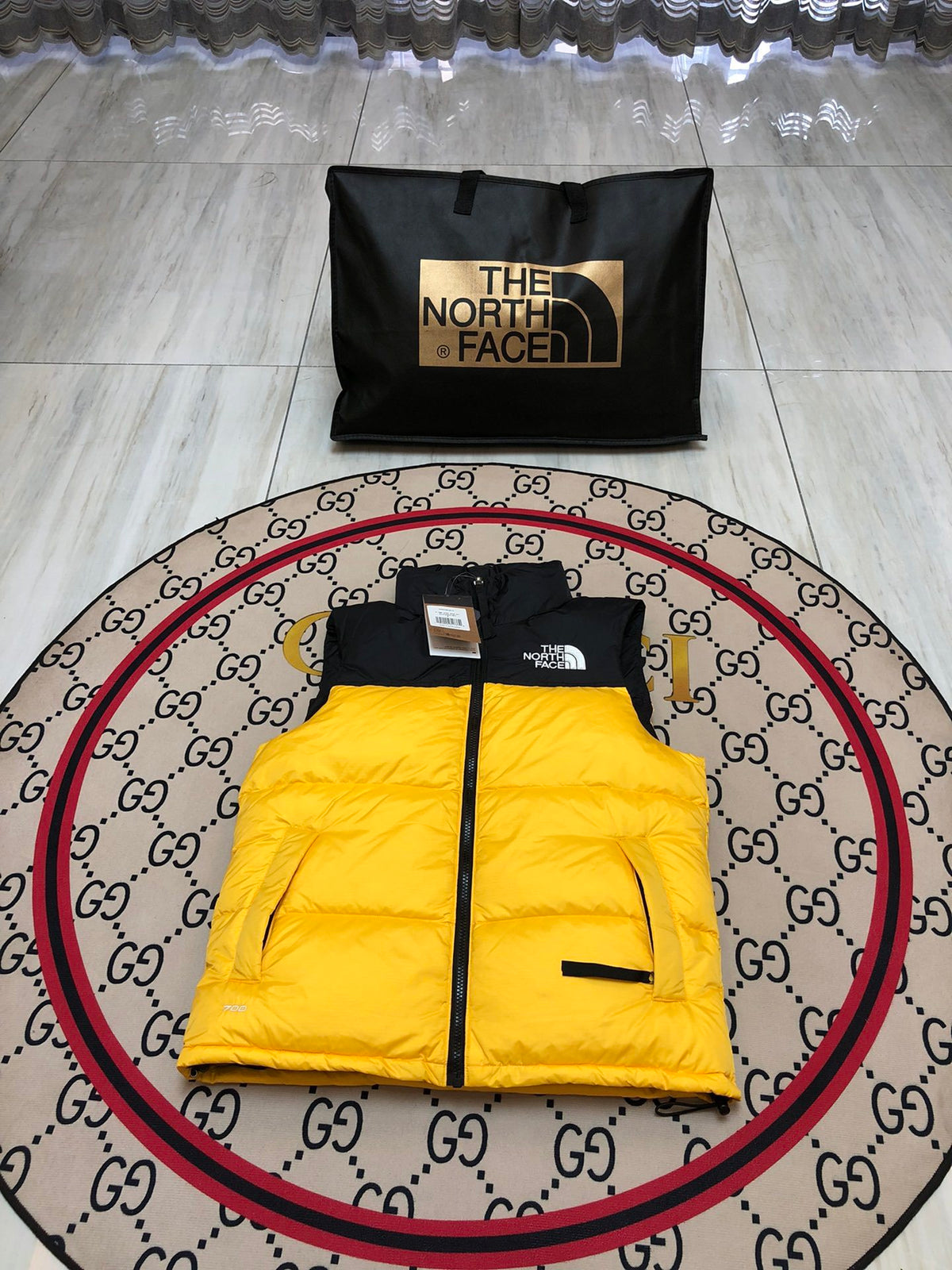 The North Face Quilted Yellow and Black Puffer Vest
