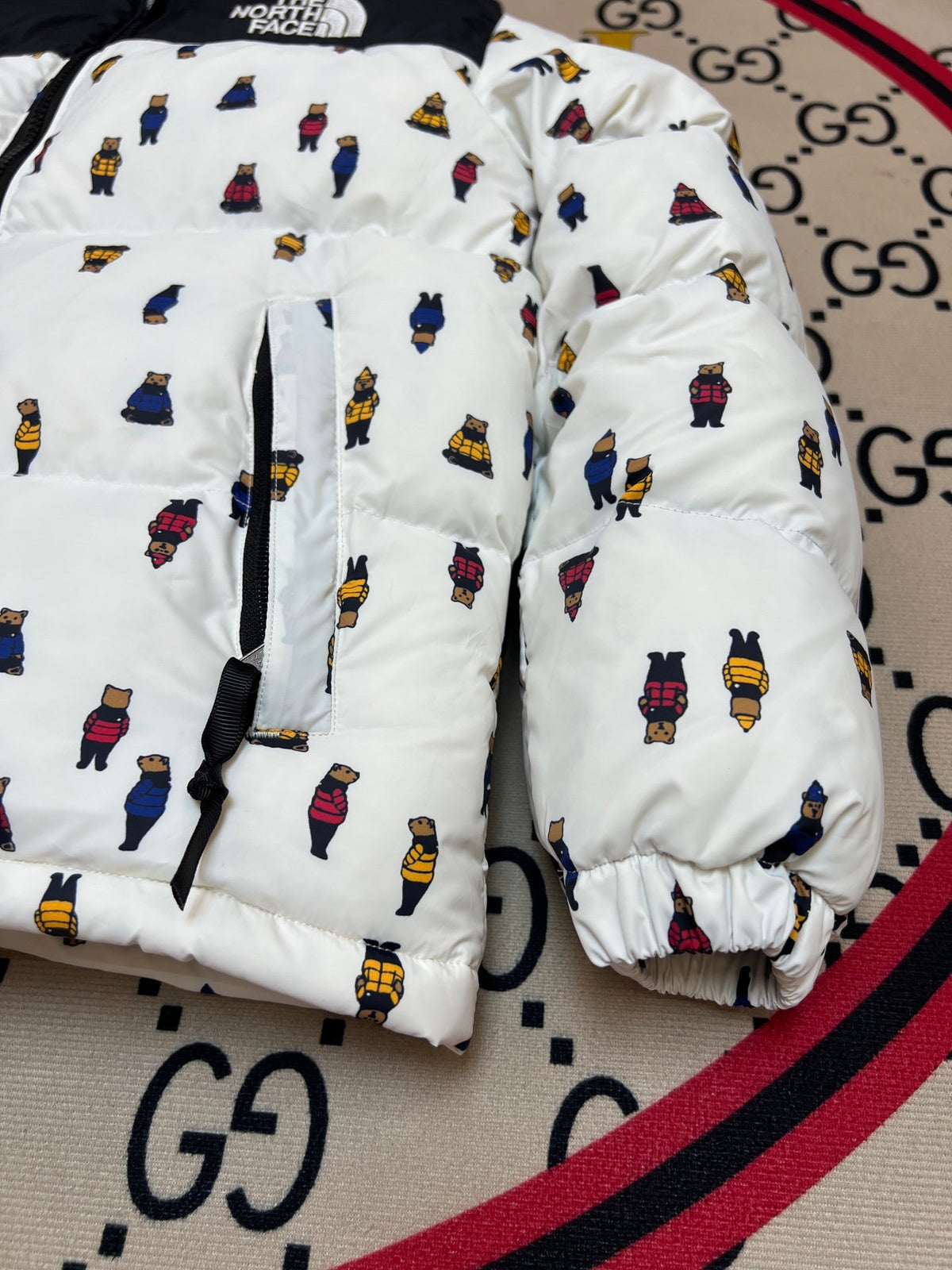 The North Face Quilted White and Black Bear-Print Puffer Jacket