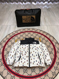 The North Face Quilted White and Black Bear-Print Puffer Jacket