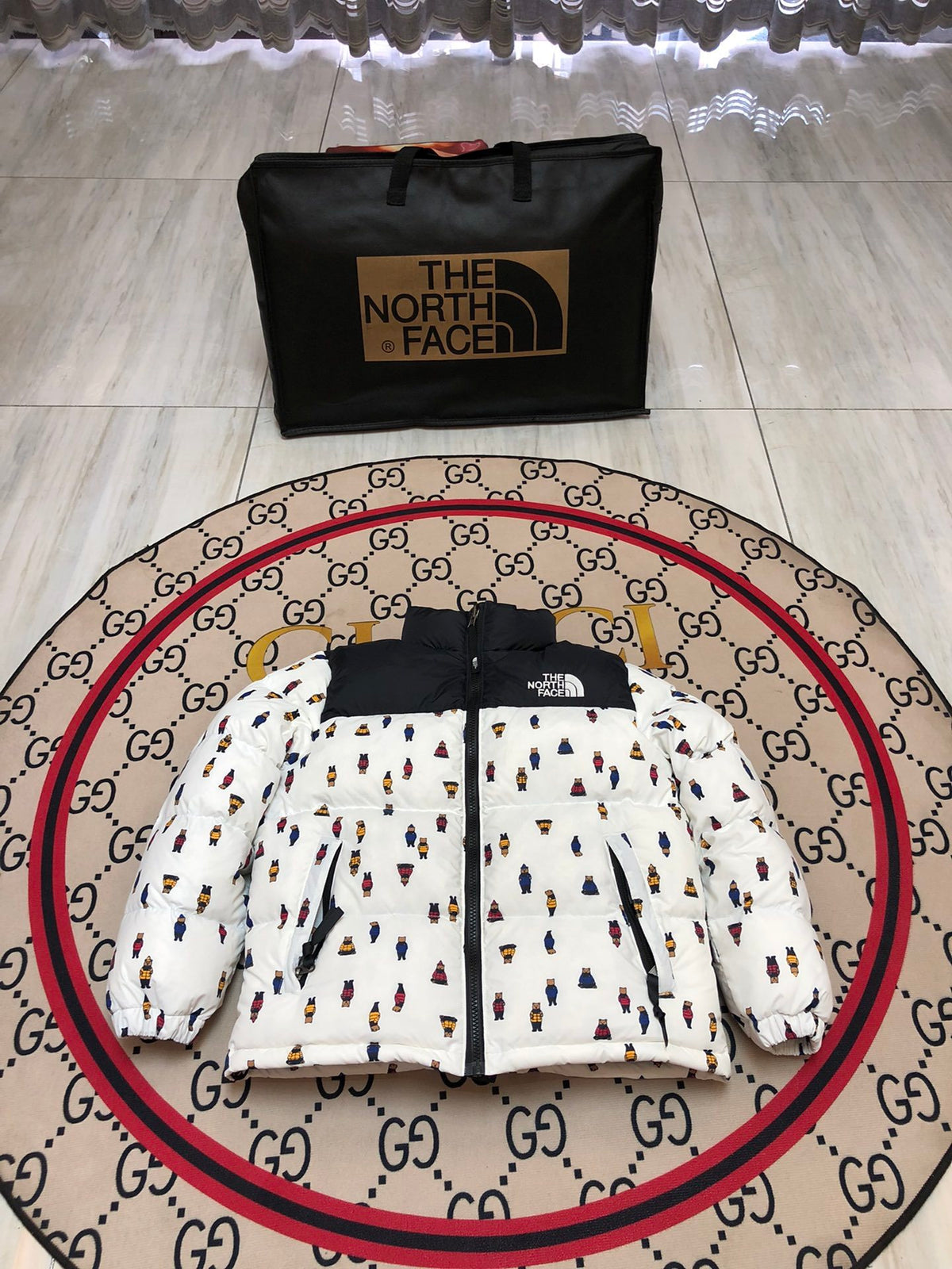 The North Face Quilted White and Black Bear-Print Puffer Jacket