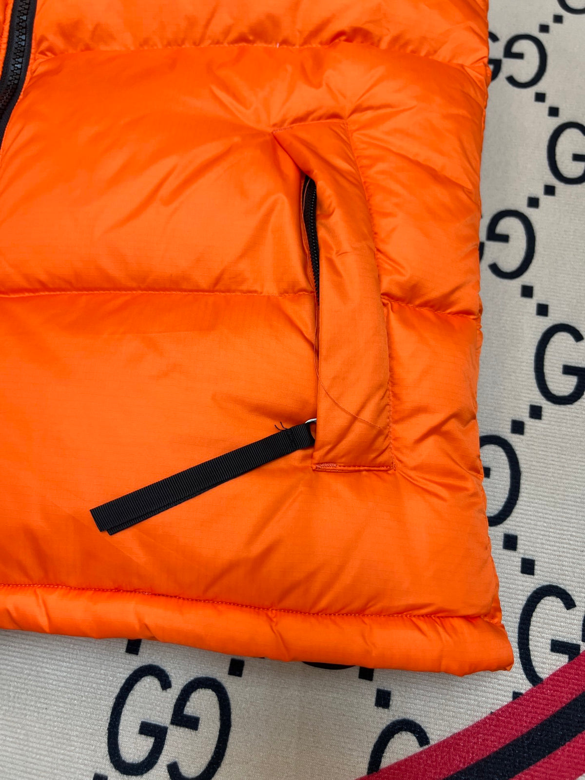 The North Face Quilted Orange and Black Puffer Vest