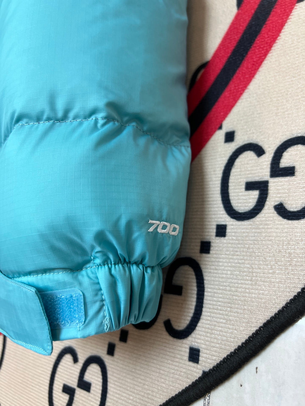 The North Face Quilted Turquoise and Purple Stand-Collar Puffer Jacket