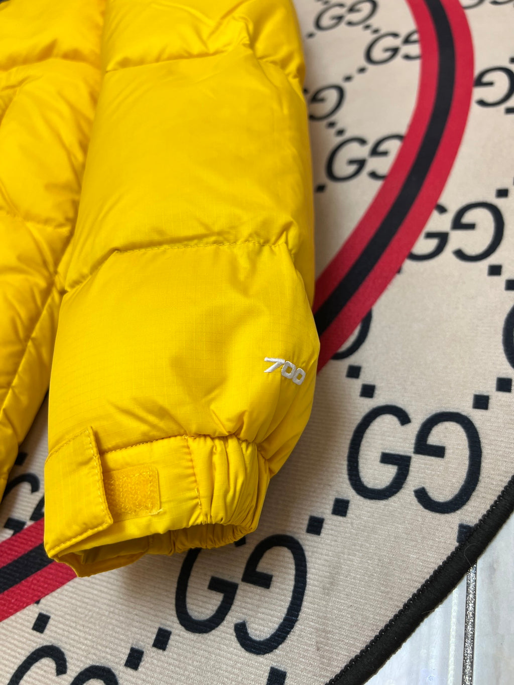 The North Face Quilted Yellow and Black Stand-Collar Puffer Jacket