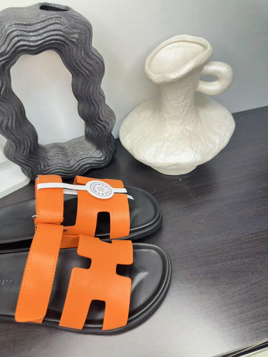 Hermès Orange Interwoven Slide Sandals - Orange and Black